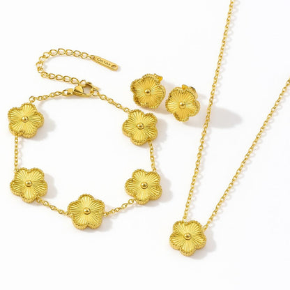 Комплект от обеци, колие, гривна във формата на детелина в златно. Изработени от неръждаема стомана